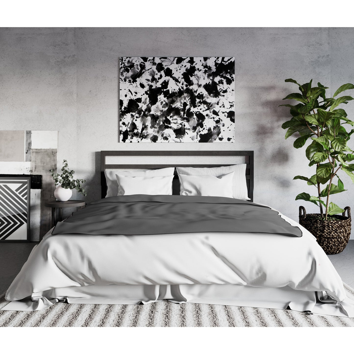 A king size grey Fascinator Splashproof Throws, Bedroom Furniture by Liberator sitting on a white bed.