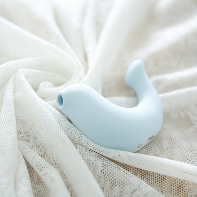 A blue G-Spa vibrator laying on a white cloth.