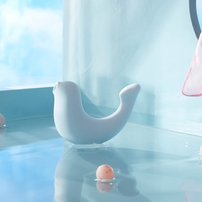 A blue G-Spa vibrator sitting in water.