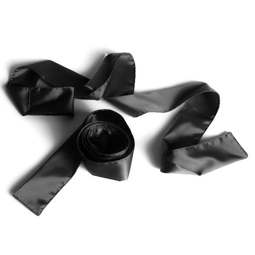 Two black Silky Tie-Ups by Liberator against a white background.