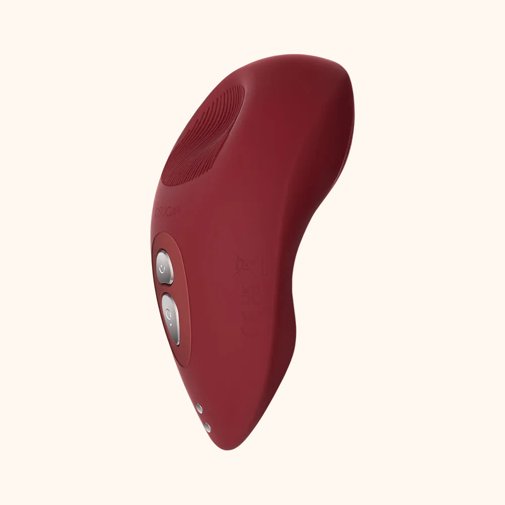 A red Tremble clitoral vibrator by Liberator against a white background.