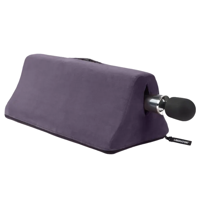 Aubergine Tula Toy Mount with wand vibrator by Liberator shown in purple microfiber. Compact shape designed for hands-free positioning and comfort.