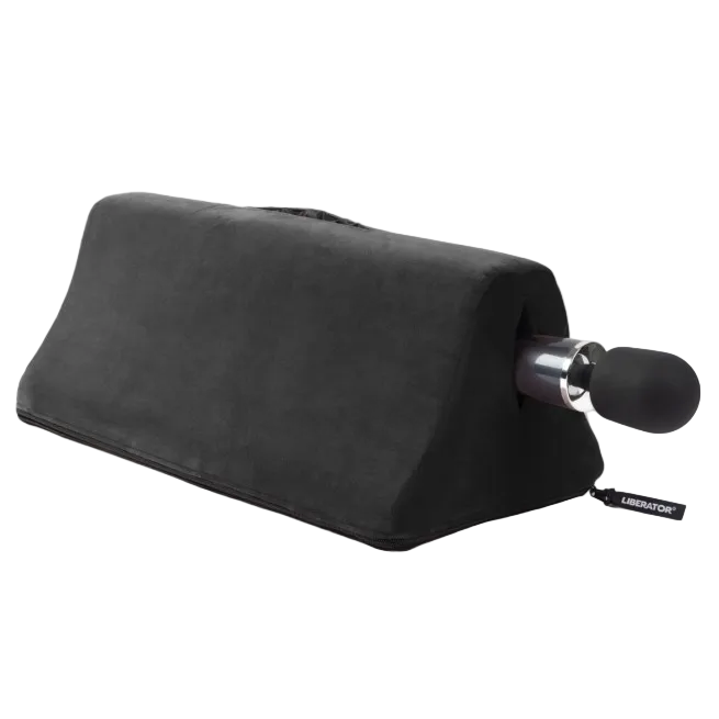Black Tula Toy Mount with wand vibrator by Liberator shown in black microfiber. Compact shape designed for hands-free positioning and comfort.