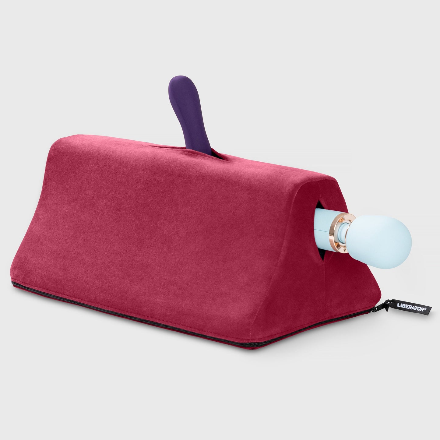 A merlot Tula Toy Mount, Bedroom Furniture by Liberator holding a Wand and a vibrator against a white background.